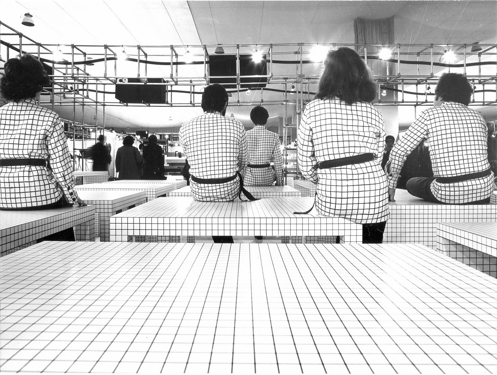 Photo of designers sitting on Super Studio Quaderna 2600 Tables